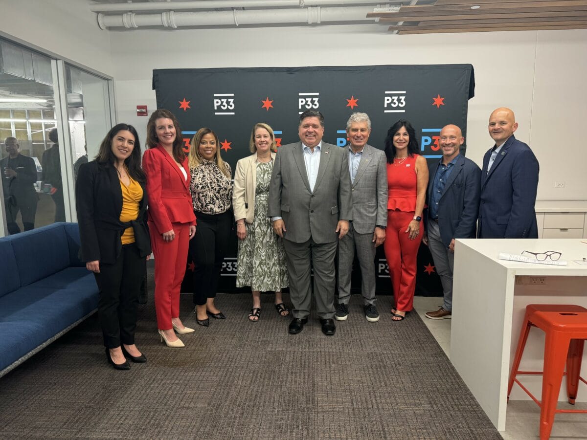 Intersect Illinois Interim CEO Paulina San Millan (far left), Illinois Governor JB Pritzker (center), and others at Chicago Climate Tech Week 2024.