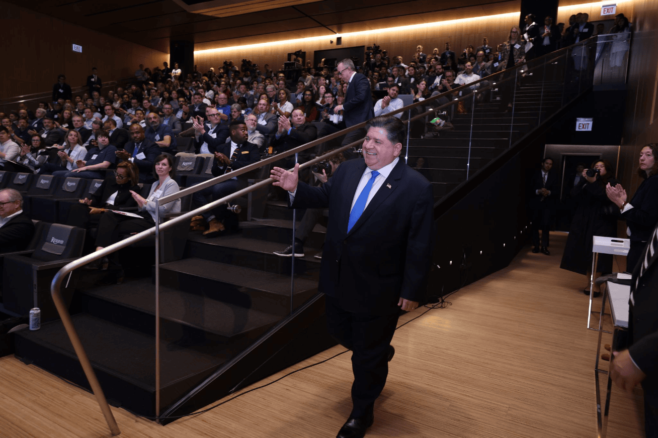 Illinois Governor JB Pritzker greets the crowd at his keynote for the 2024 Chicago Quantum Summit.